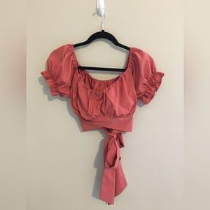 Identical cropped peasant short sleeve shirts and one high slit wrap skirt.